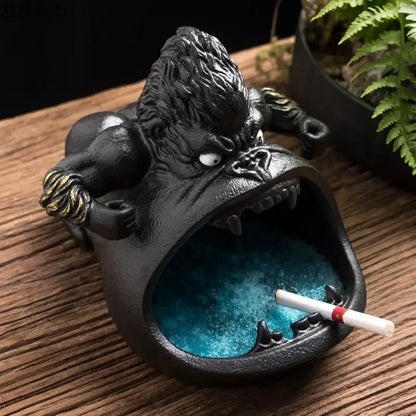 Black gorilla ceramic ashtray with textured fur gold accents and blue glittery ashes for living room decorbites gorilla ceramic