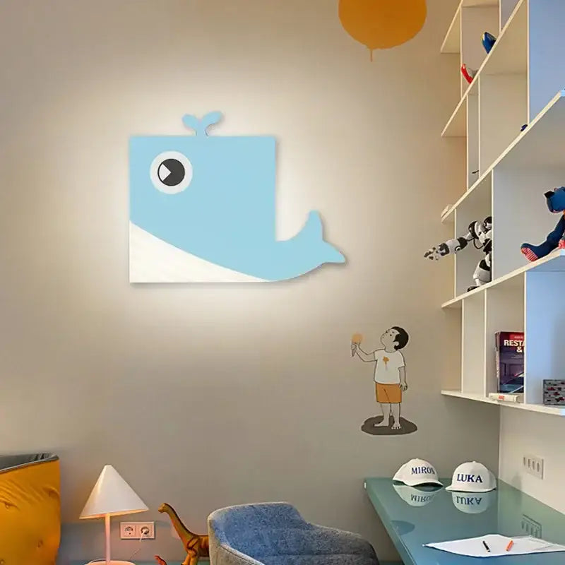 Light blue and white cartoon wall lamp shaped like a whale with a led light for bedroom wall art