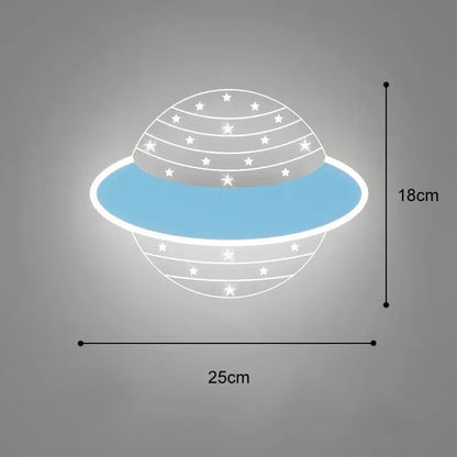A modern cartoon wall lamp shaped like a blue and white whale with glowing star patterns for bedroom decor