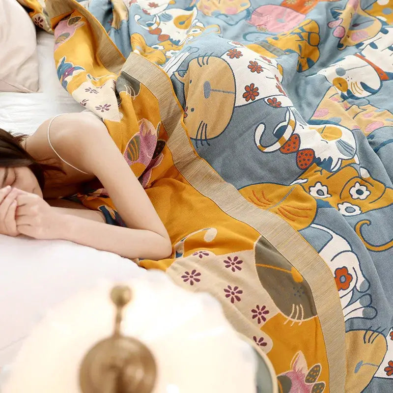 A decorbites cartoon boho bedspread blue cat woven cotton blanket featuring a playful quilt design in soft yellow and blue tones