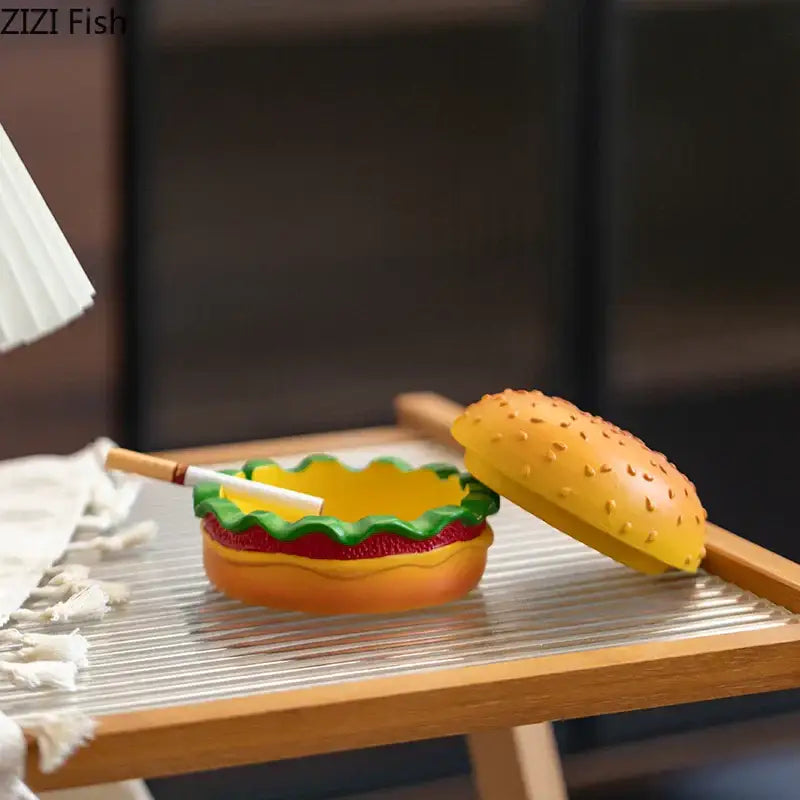 Yellow and green resin cartoon burger ashtray with sesame seed detail for office table decor