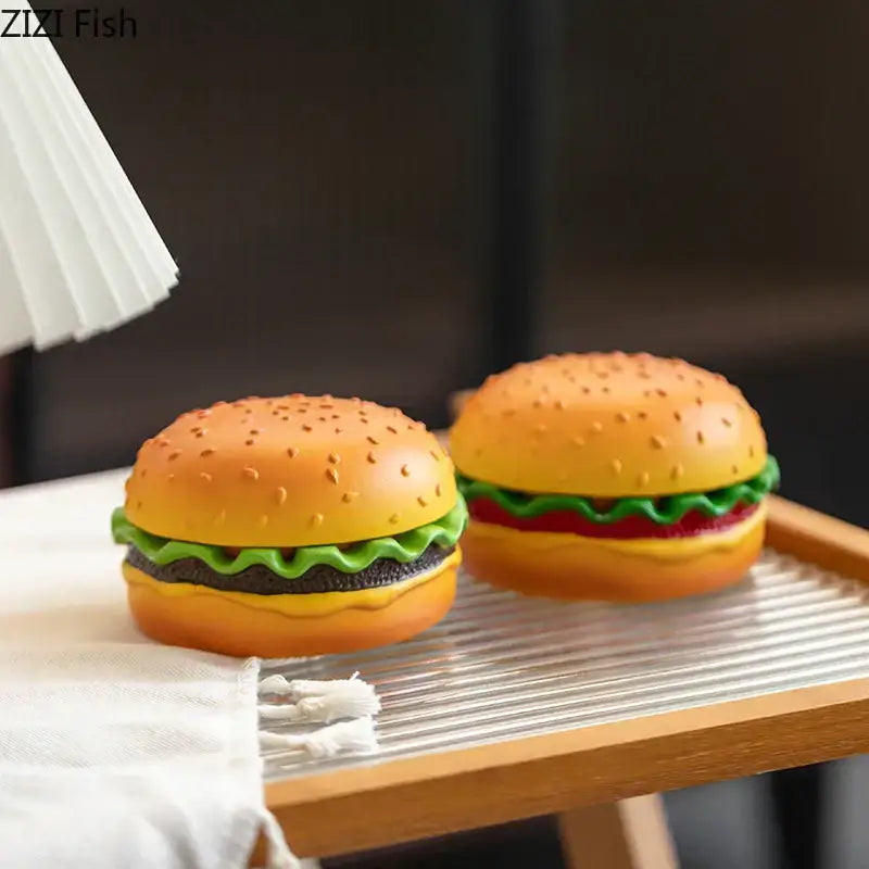 Orange plastic cartoon burger ashtray with green lettuce red tomato and yellow cheese layers for office table decor