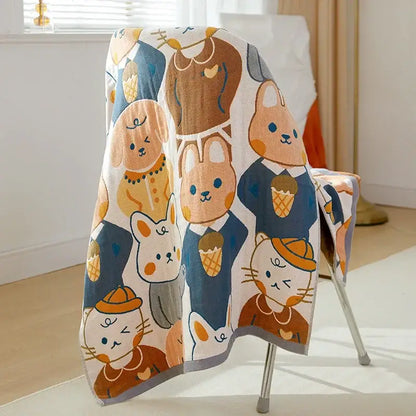 A soft white cotton gauze bath towel featuring cartoon cats and dogs in formal attire holding ice cream cones