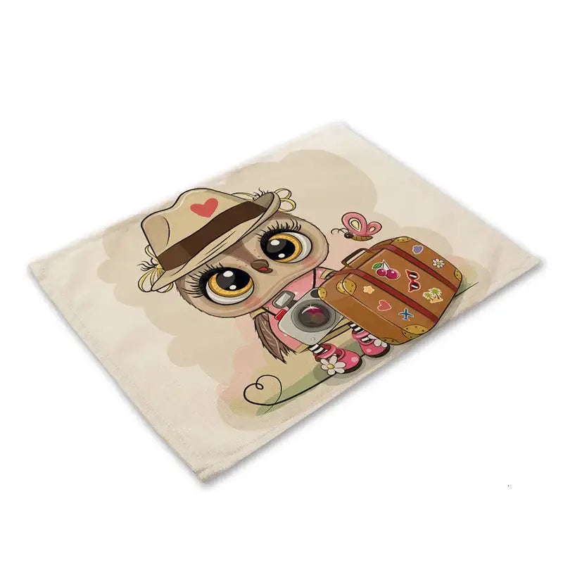 Beige fabric dining table placemat featuring decorbites cute owl animal with hat, camera, and suitcase design