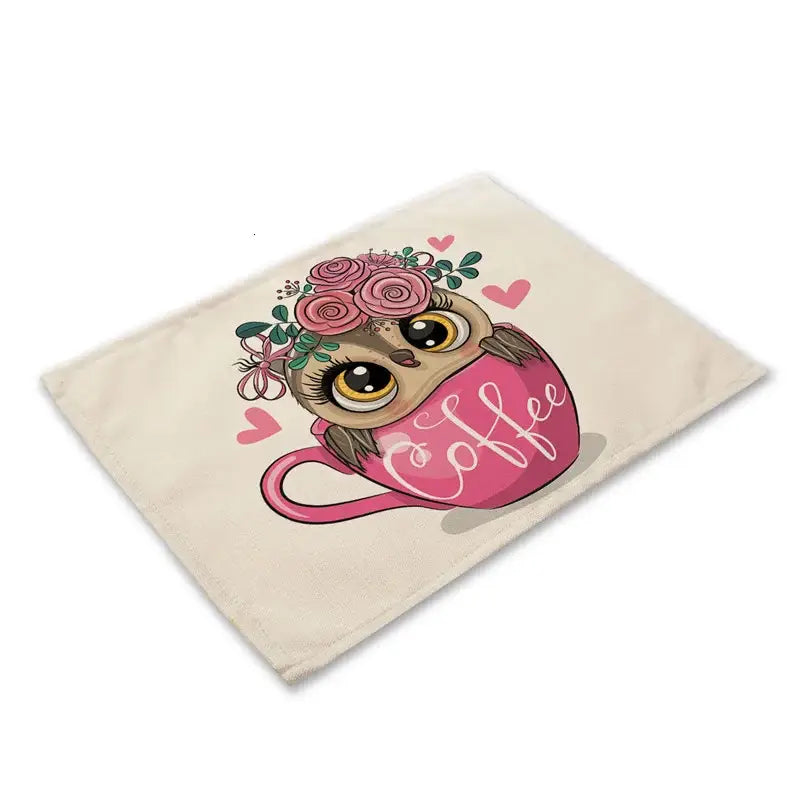 Cream-colored canvas dining table placemat featuring decorbites cute owl with large yellow eyes in pink cup design
