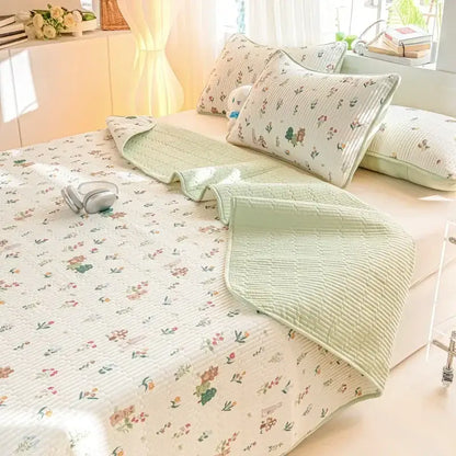 Light green cotton quilted cartoon dinosaur bed cover set with floral pattern and matching pillowcases for bedroom use