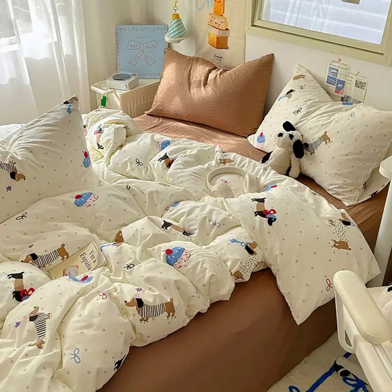 Cream cotton fitted sheet set featuring playful cartoon dachshunds and bows on a soft textured fabric