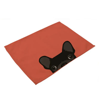 Rectangular orange cotton linen dining table mats with a black cartoon french bulldog design set of 4