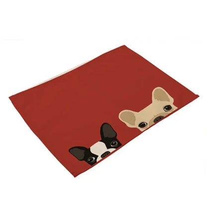 Red rectangular cotton linen dining table mats featuring cartoon french bulldogs peeking over the edge set of 4