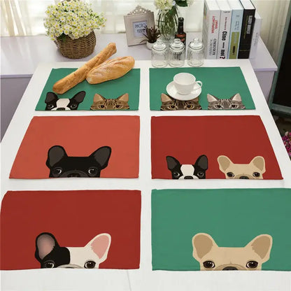 Set of six colorful cotton linen dining table mats featuring cartoon dog and cat faces on soft fabric material