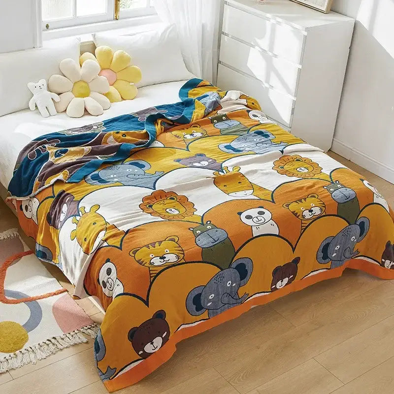 A cozy cartoon lion cotton throw blanket in yellow and gray featuring playful lion and animal patterns for decorbites