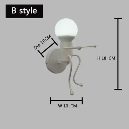 White ceramic wall lamp with spherical bulb and whimsical articulated legs decorbites cartoon matchstick man sconce for kids room