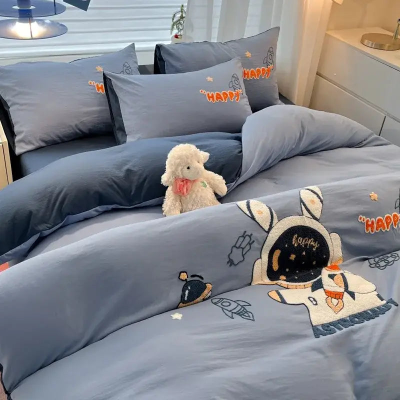 Blue astronaut-themed duvet cover bedding set with embroidered details and orange happy text decorbites cartoon pattern