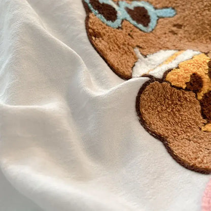 White fabric bedding sets with cartoon pattern embroidered brown bear wearing light blue sunglasses for bedroom decor
