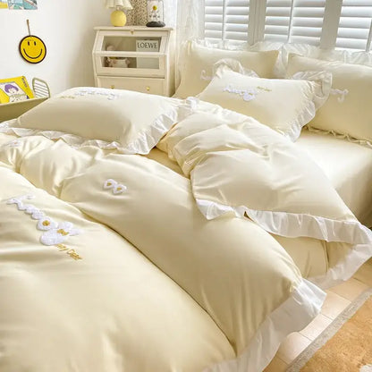 Cream-colored bedding set with delicate white ruffles and embroidered floral appliqués for decorbites cartoon princess bedroom