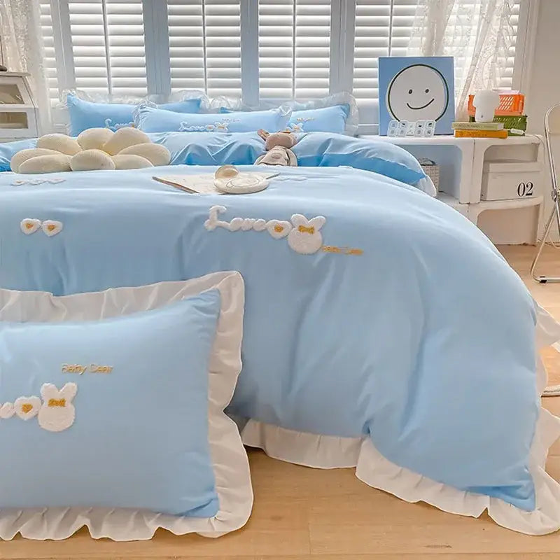 Light blue bedding set with white ruffled edges and embroidered bunny designs from decorbites cartoon princess collection