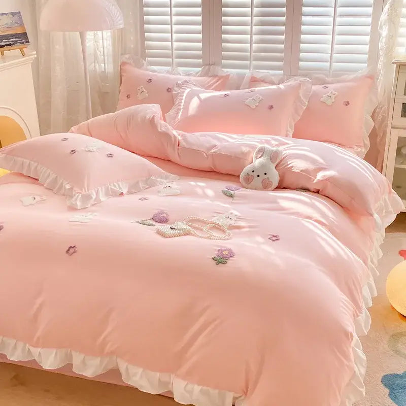 Pink ruffled bedding set with embroidered white bunny and floral motifs from decorbites cartoon princess collection