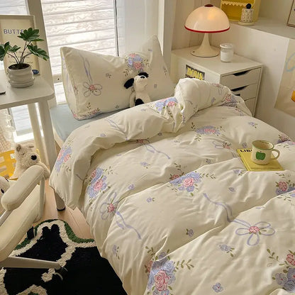 Cream-colored decorbites cartoon printed bedding set with pastel pink lavender blue floral cotton fabric for bedroom use