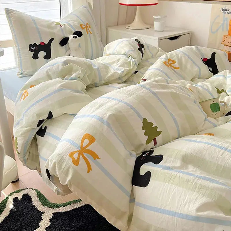A cozy cream-colored cartoon printed bedding set with light blue stripes and playful cat decorbites cartoon printed design