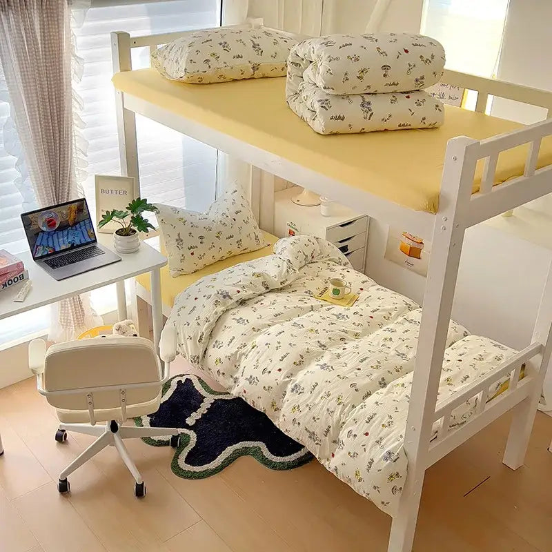 White wooden bunk bed with yellow mattress toppers and decorbites cartoon printed cartoon printed bedding sets cream and blue cat duvet set