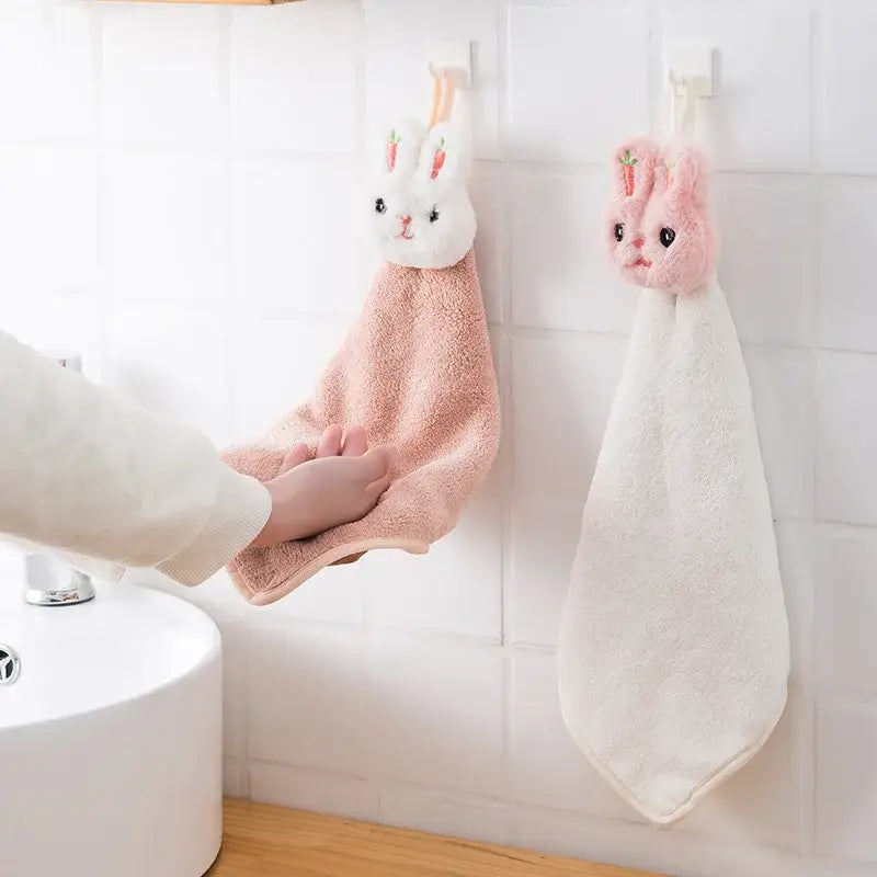 Soft pink and white coral fleece cartoon rabbit hand towel with embroidered carrot details for quick dry use