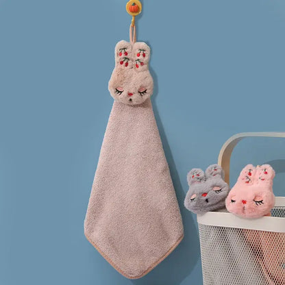 A soft pink coral velvet hand towel featuring plush bunny decorbites cartoon rabbit embroidery with hanging loop