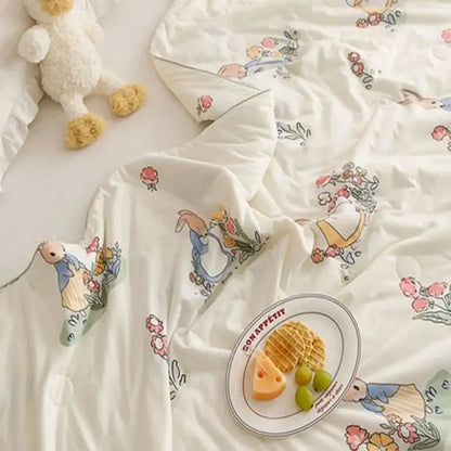 White duvet cover cooling summer blanket with peter rabbit pattern and pastel floral accents for bedroom quilt