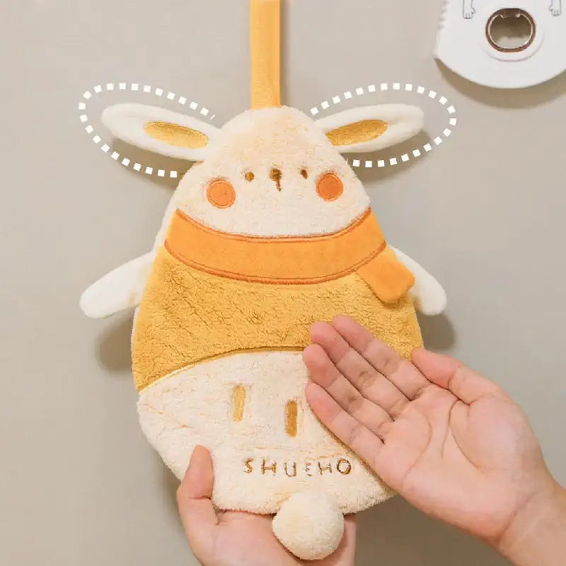 Cute beige and orange plush rabbit-shaped towel with embroidered details in decorbites cartoon sloth hand towels set