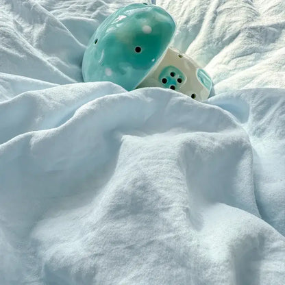 Turquoise ceramic mushroom with white polka dots and black holes as decorbites cartoon towel embroidery bedding set decor