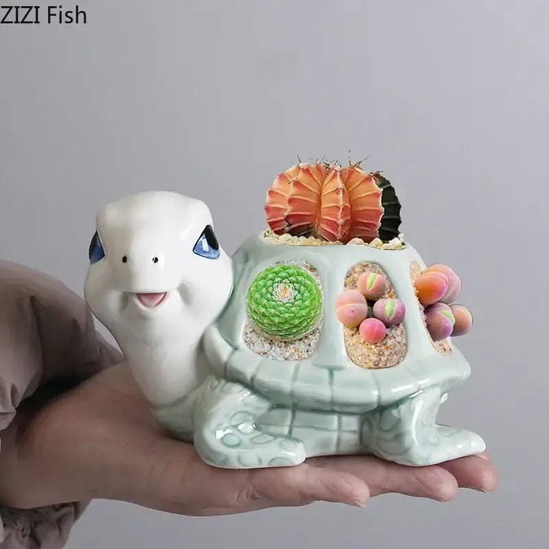 Cartoon turtle ceramic planter with white face blue eyes and green shell featuring three cactus slots for living room decorbites decor