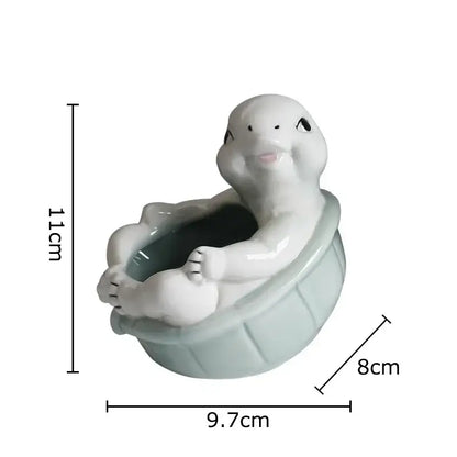 Cartoon turtle ceramic flower vase in glossy white and light green glaze sitting in matching basin planter decorbites cartoon turtle