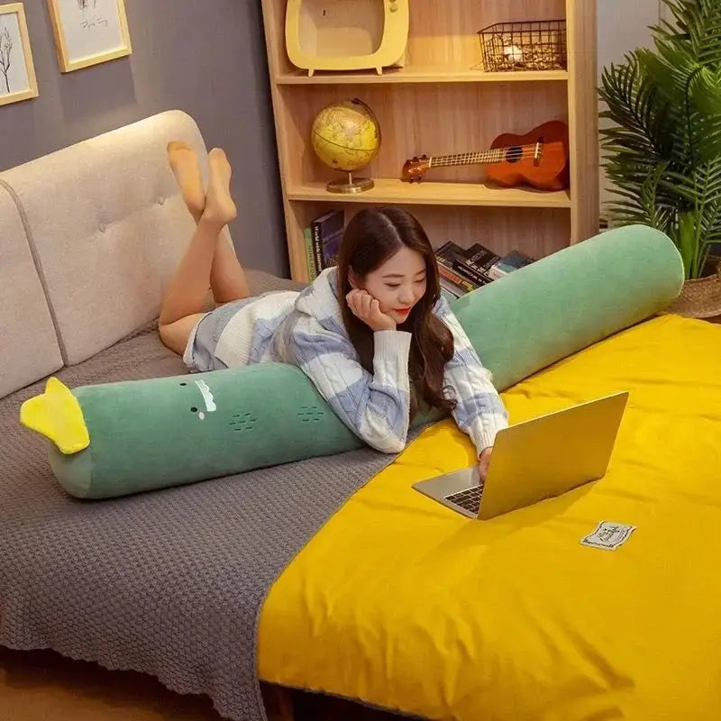 A plush mint-green dinosaur comfort long body pillow with yellow tail and embroidered face for decorbites comfort long use