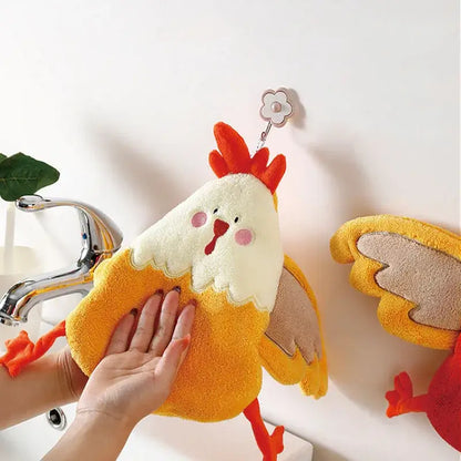 A plush yellow and white chicken coral velvet cartoon hand towel with orange feet and red comb for kitchen decor