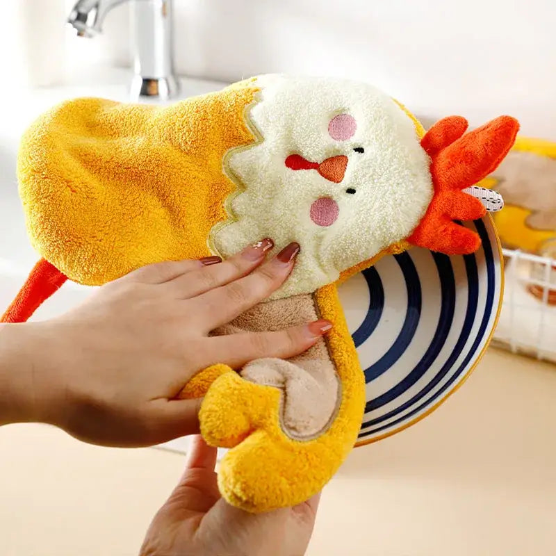 Yellow plush chicken-shaped hand towel with embroidered face and orange beak made of decorbites coral velvet cartoon fabric