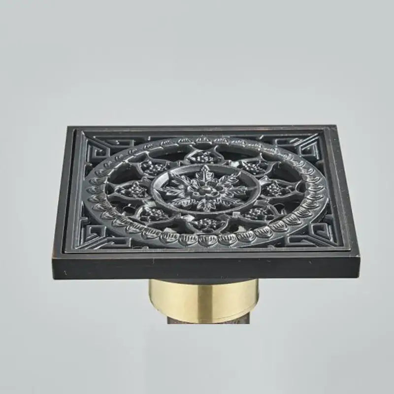 Carved decorbites black anti-odor floor drain with floral embossed patterns and brass base for bathroom hardware