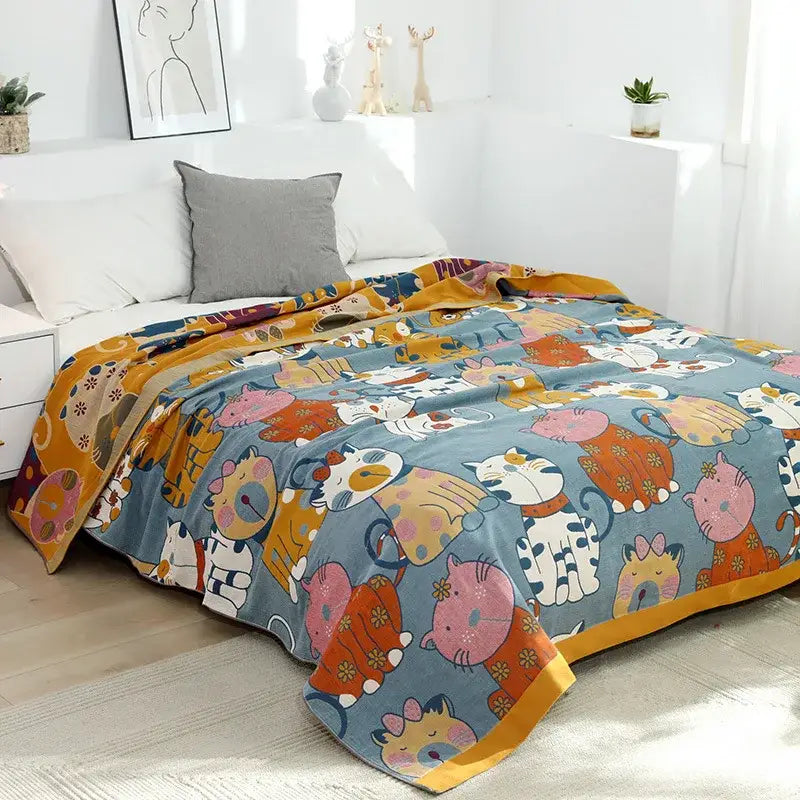 A cozy blue pure cotton gauze towel blanket with playful cat cartoon animal pattern for bedroom decorbites decor