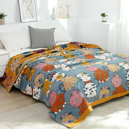 A cozy blue pure cotton gauze towel blanket with playful cat cartoon animal pattern for bedroom decorbites decor
