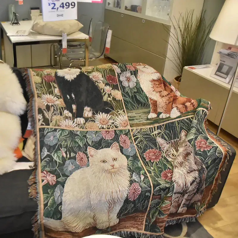 A dark green woven cat sunflower knitted sofa cover with detailed cat and floral patterns and fringed edges for living room decorbites