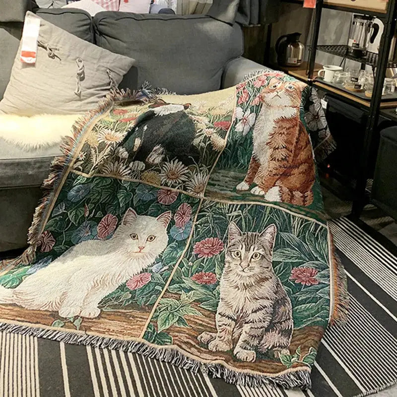 A woven cat sunflower knitted sofa cover blanket featuring white orange and gray tabby cats with floral decorbites design