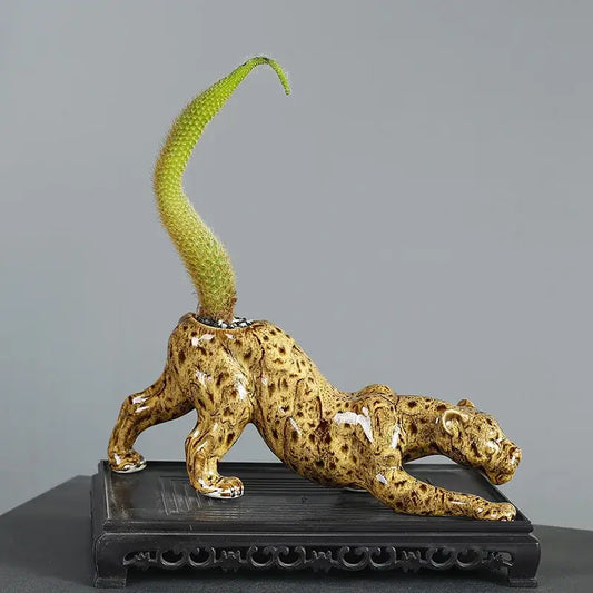 Ceramic animal flowerpot leopard with glossy golden-brown glaze and green cactus from decorbites ceramic decor