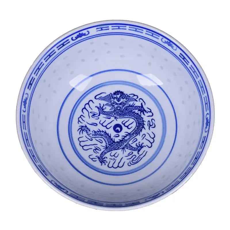 A white ceramic dragon print nested bowl set with blue hand-painted motifs and yin-yang symbol for dining room decorbites ceramic dragon