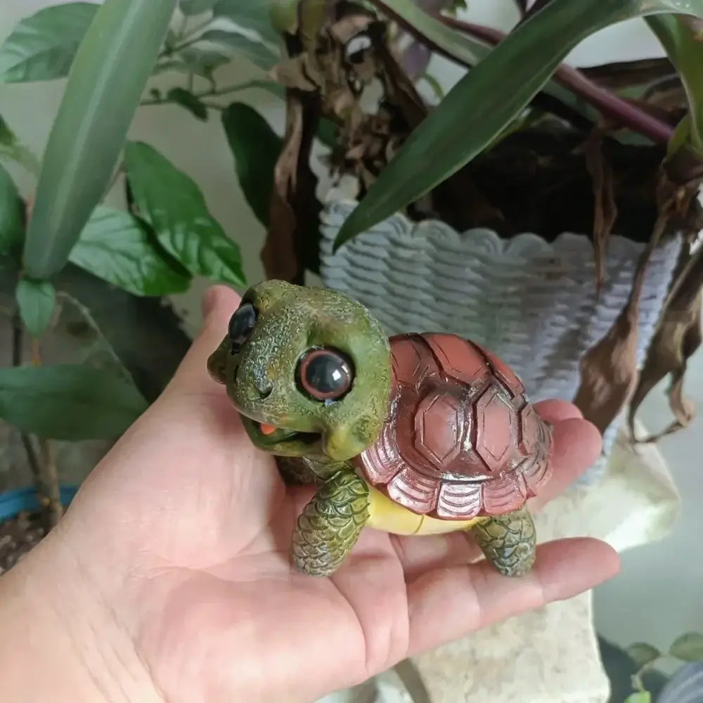 Charming green and brown plastic crawling turtle sculpture with glossy eyes and detailed shell for decorbites crawling turtle decor
