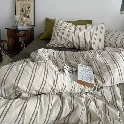 Cream-colored satin duvet cover set with thin dark gray vertical stripes for bedroom bedding use