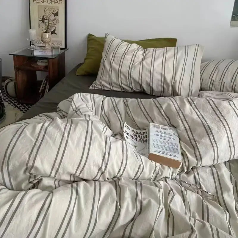 Cream-colored satin duvet cover set with thin dark gray vertical stripes for bedroom bedding use