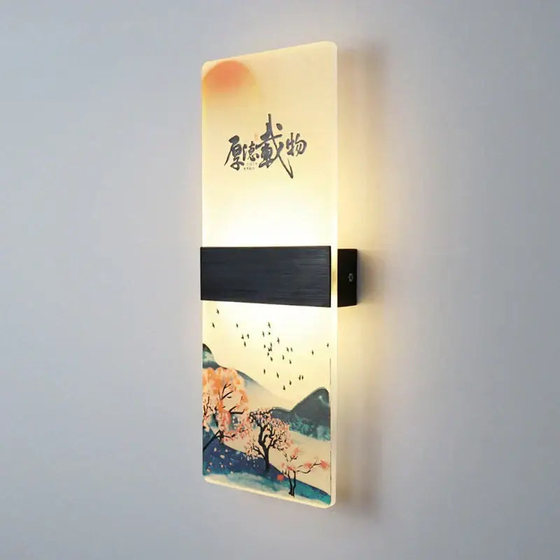 Rectangular wall lamp with warm glow featuring a traditional chinese landscape acrylic shade and dark wood-textured strip