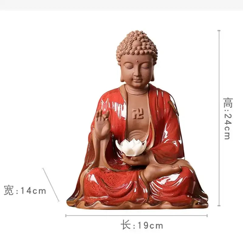 A glossy red ceramic sakyamuni buddha statue holding a white lotus flower for living room decor