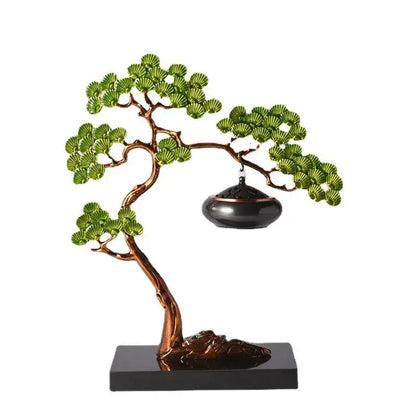 Bronze-colored bonsai tree sculpture with green enamel pine ornaments and a hanging black incense burner for living room use