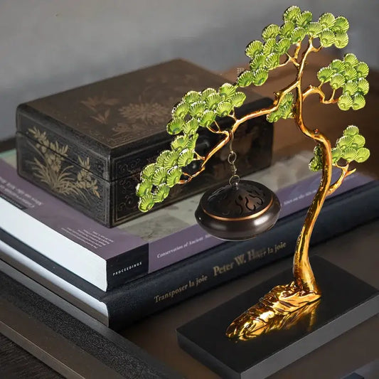 Golden bonsai tree figurine with green fan-shaped leaves and hanging dark bronze incense burner as enamel pine ornaments