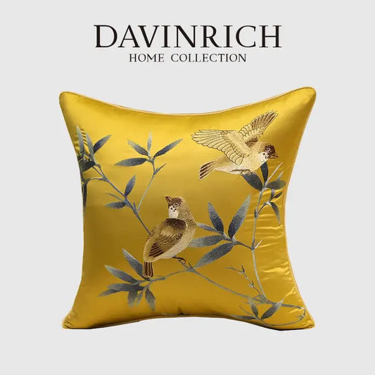 A golden-yellow satin pillow cover from davinrich home featuring birds branches embroidered decorbites design