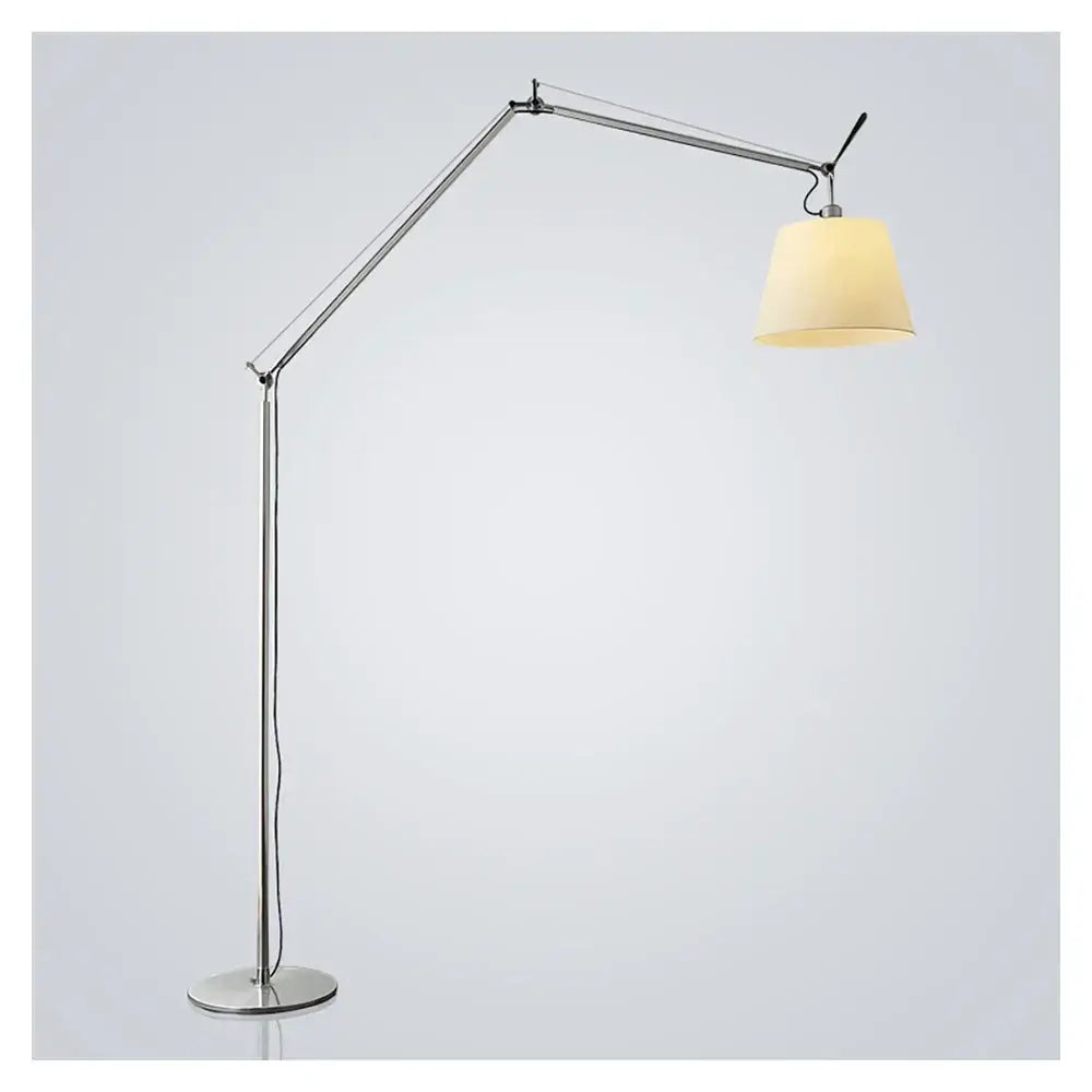 Silver articulated floor lamp with cream fabric shade complementing decorbites adjustable industrial wall light design